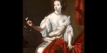Portrait of a woman in a pale gown with ruffles, seated beside red drapery, gently releasing a butterfly.